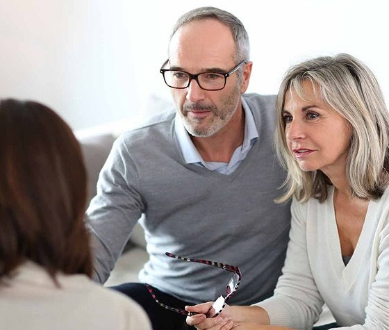 three people talking
