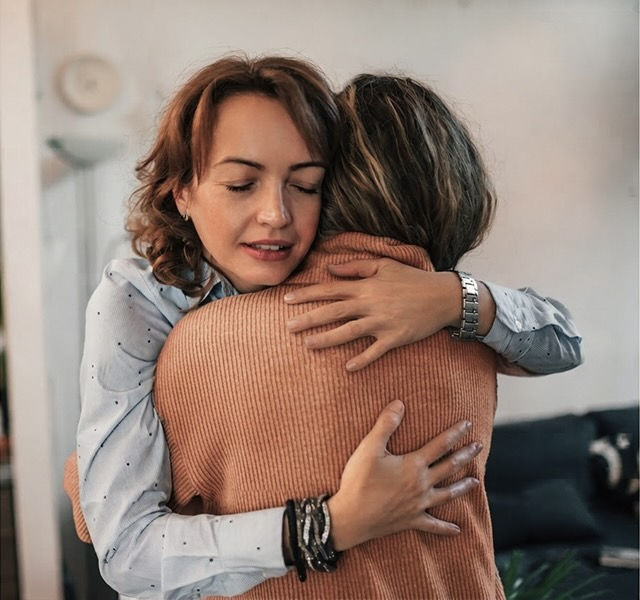 two women hugging