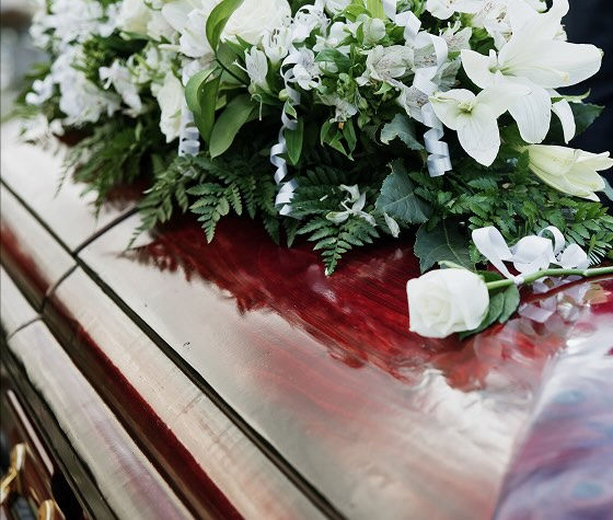 flowers on top of a coffin