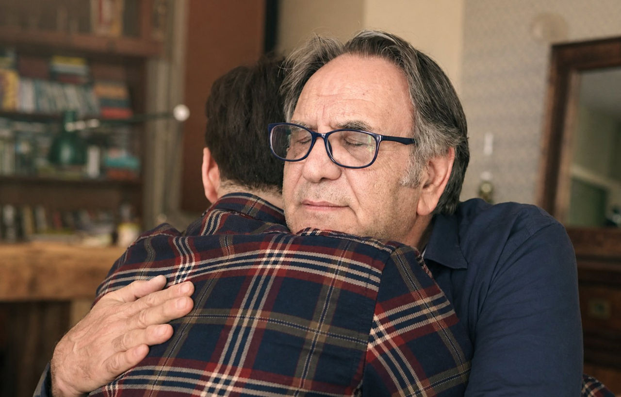 a father hugging his son